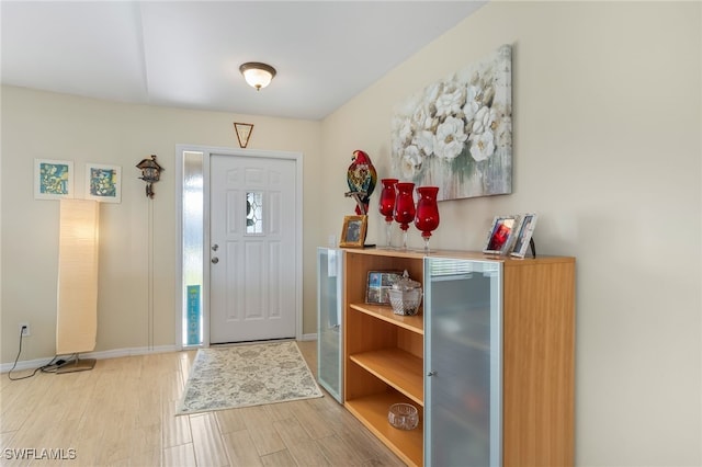 403 SE 28th Ter, Cape Coral, FL 33904 - entryway with baseboards and wood finished floors