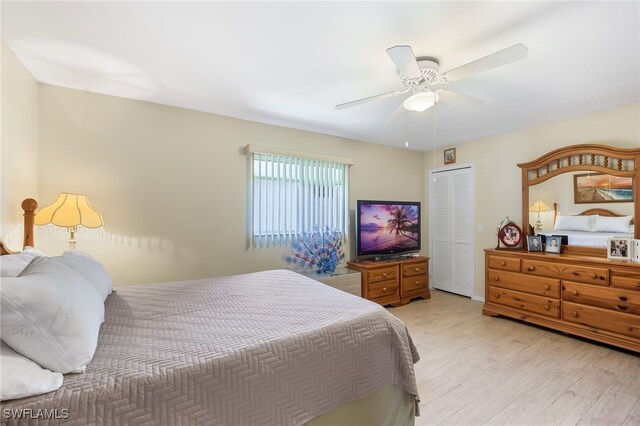 bedroom featuring light hardwood / wood-style flooring, a closet, and ceiling fan