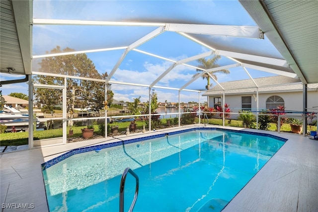 view of pool with a water view, a patio area, and glass enclosure