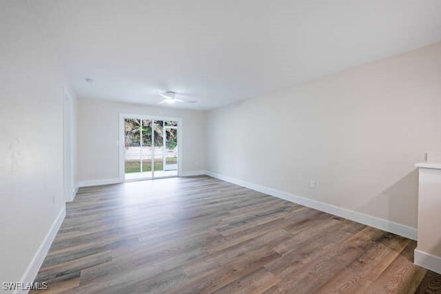 unfurnished room with hardwood / wood-style flooring