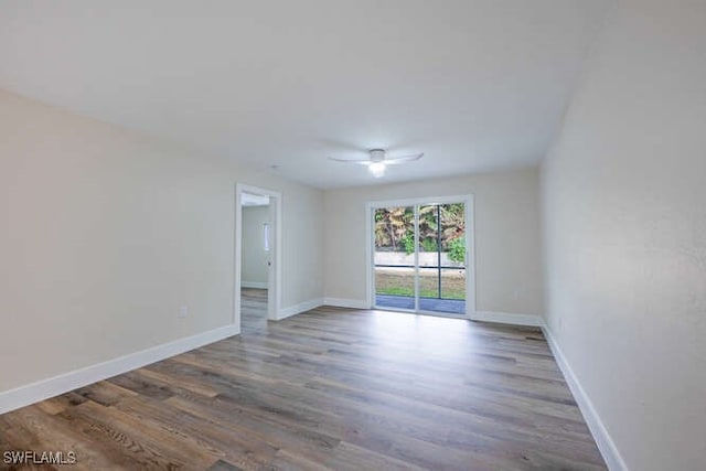 unfurnished room with hardwood / wood-style floors and ceiling fan