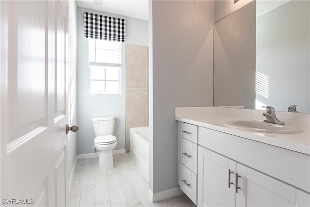 full bathroom featuring vanity, washtub / shower combination, and toilet