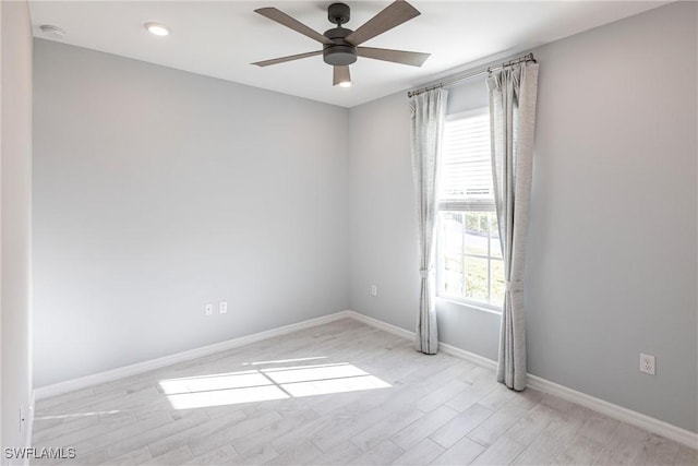 unfurnished room featuring light hardwood / wood-style flooring and ceiling fan