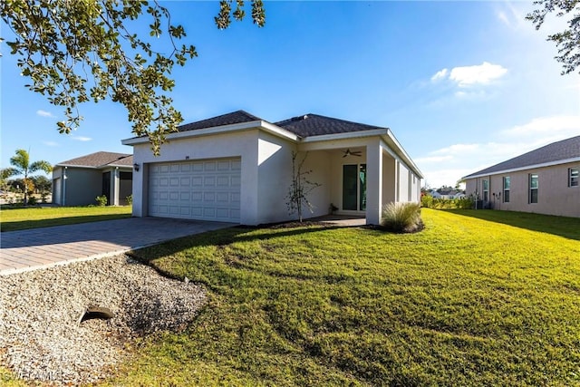 view of front of home featuring a garage and a front yard