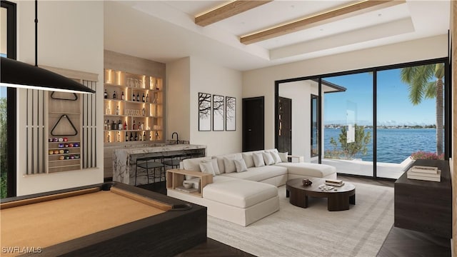 living room featuring bar, a water view, pool table, parquet flooring, and beamed ceiling