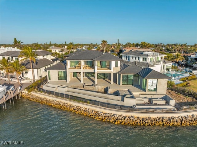 back of house with a water view