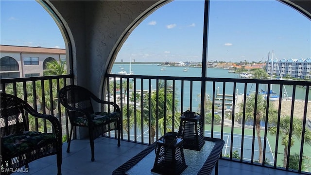 balcony featuring a water view