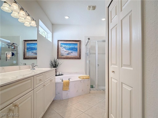 bathroom featuring vanity, tile patterned floors, and independent shower and bath