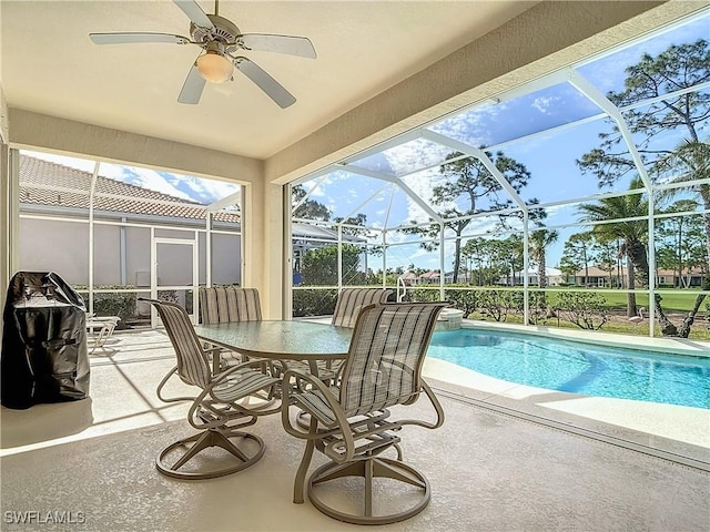 view of swimming pool featuring a lanai and a patio area