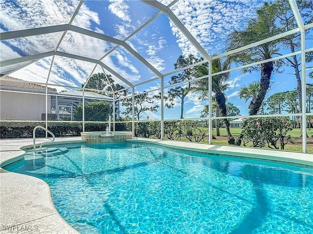 view of pool featuring an in ground hot tub and a lanai