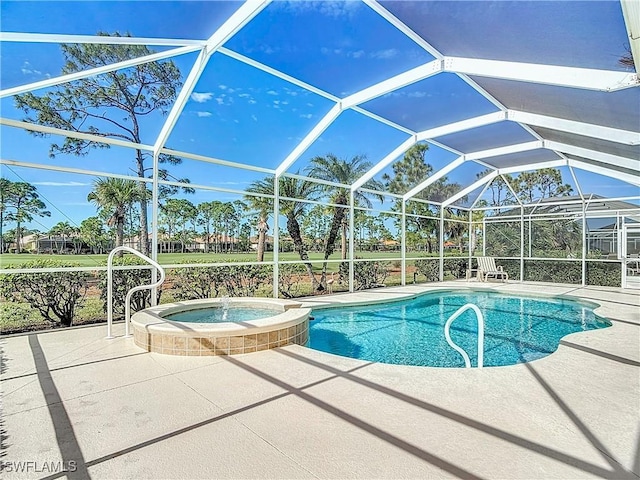 view of pool featuring an in ground hot tub, a lanai, and a patio area