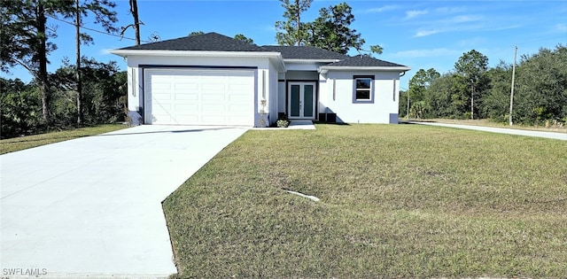 ranch-style home featuring a garage and a front yard