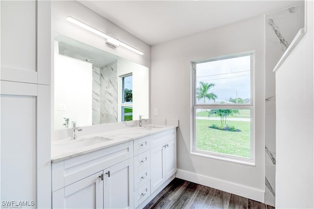 bathroom with vanity and wood-type flooring