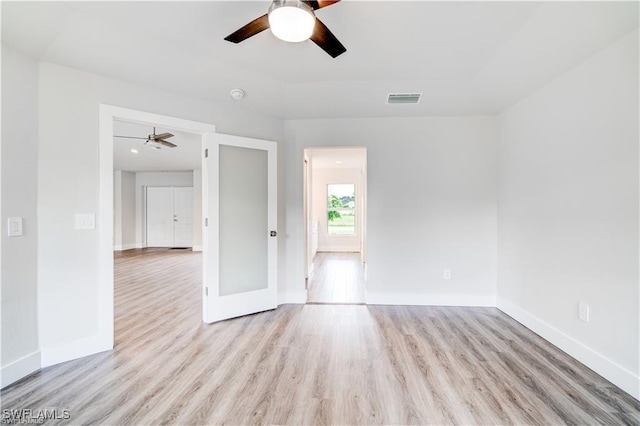 spare room featuring light hardwood / wood-style flooring and ceiling fan