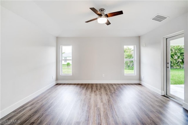 unfurnished room with hardwood / wood-style flooring and ceiling fan