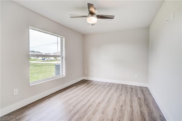 unfurnished room with ceiling fan and light hardwood / wood-style flooring