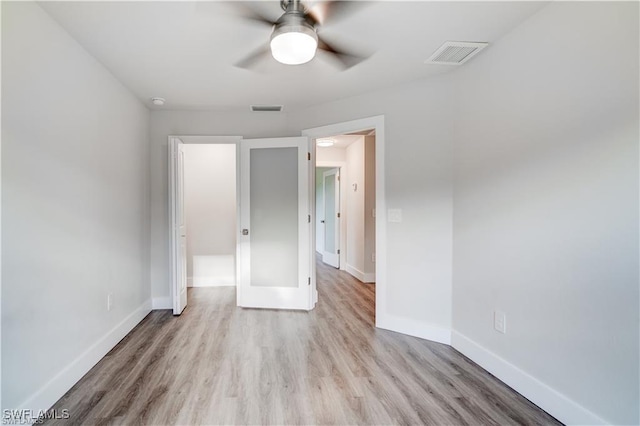 unfurnished bedroom with light wood-type flooring and ceiling fan