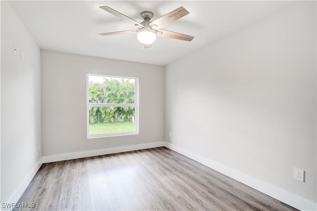 unfurnished room with ceiling fan and light hardwood / wood-style flooring