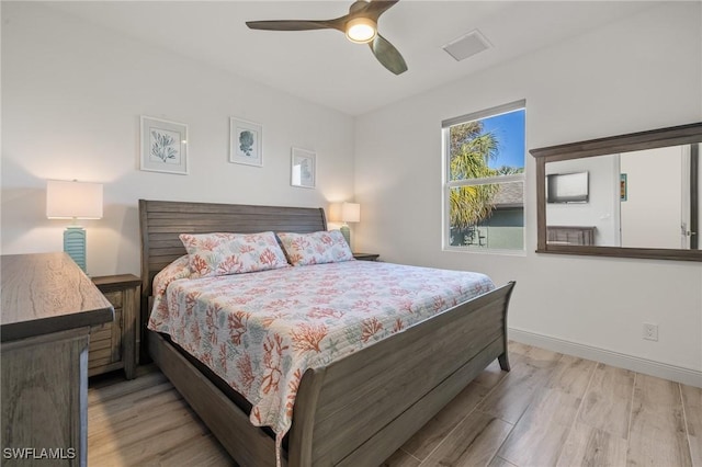 bedroom featuring ceiling fan and light hardwood / wood-style floors