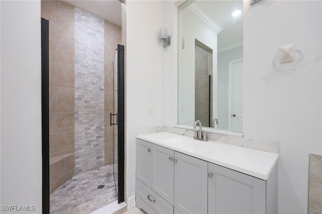 bathroom featuring an enclosed shower, vanity, and ornamental molding