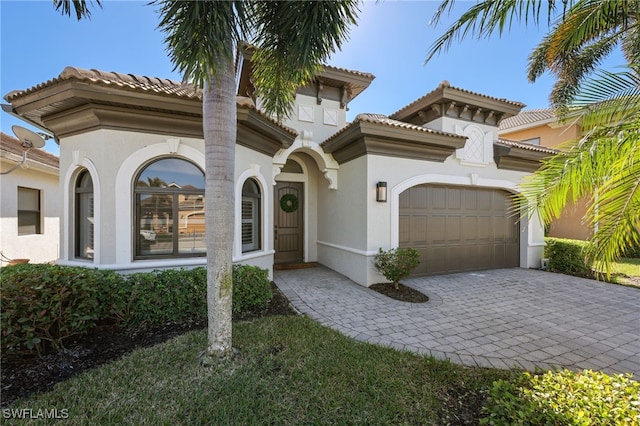 mediterranean / spanish-style home featuring a garage