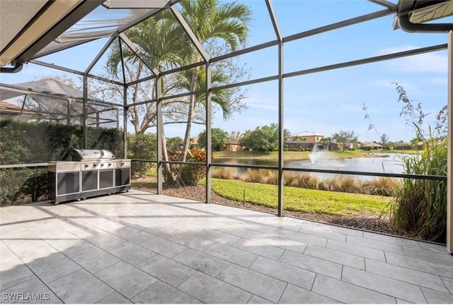 unfurnished sunroom with a water view