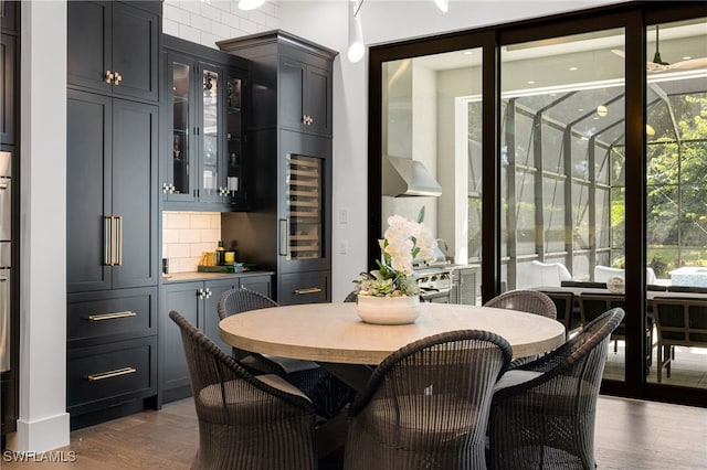 dining room featuring dark wood-type flooring and wine cooler