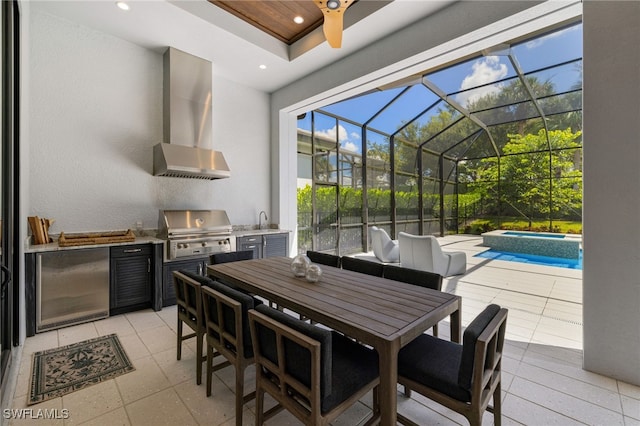 view of patio / terrace featuring area for grilling, sink, a lanai, grilling area, and a pool with hot tub