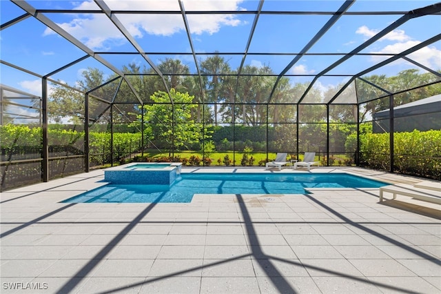 view of swimming pool featuring an in ground hot tub, a lanai, and a patio