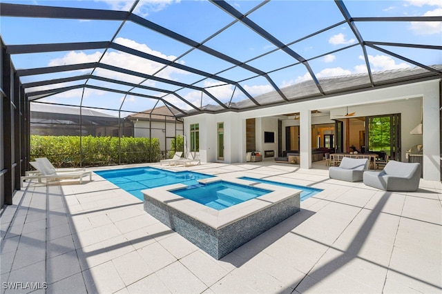 view of swimming pool featuring an in ground hot tub, ceiling fan, an outdoor hangout area, and glass enclosure