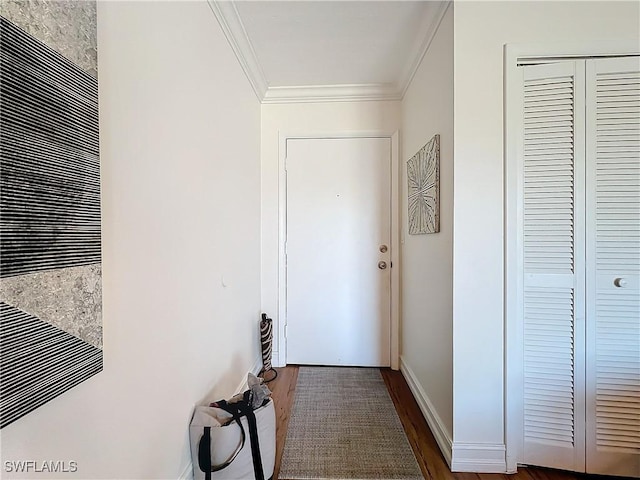 corridor featuring dark wood-type flooring and ornamental molding