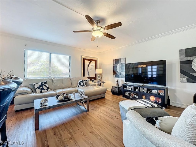 living room with wood-type flooring, ceiling fan, and crown molding