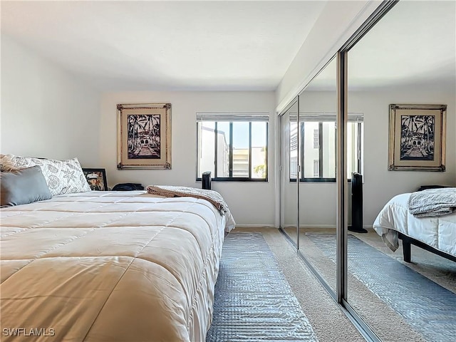 carpeted bedroom featuring a closet