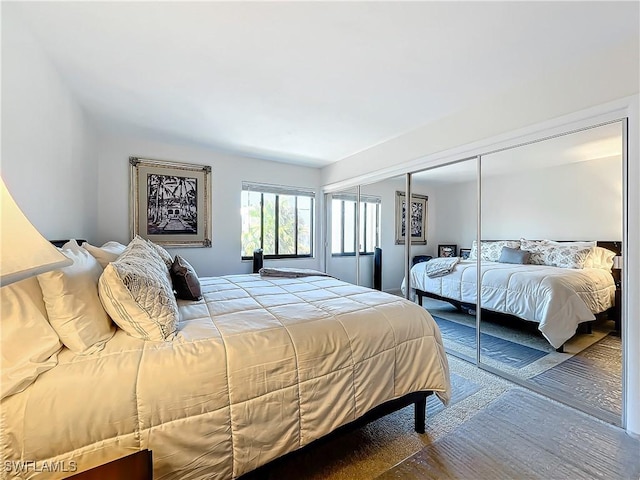 bedroom with hardwood / wood-style floors