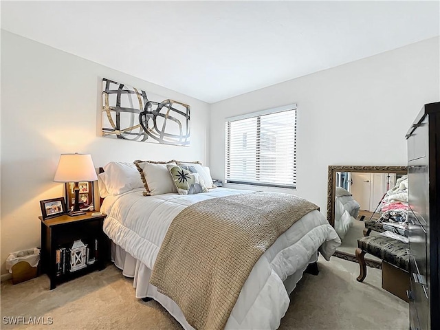 bedroom with light carpet