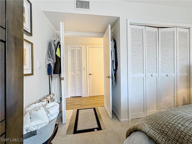 carpeted bedroom featuring a closet