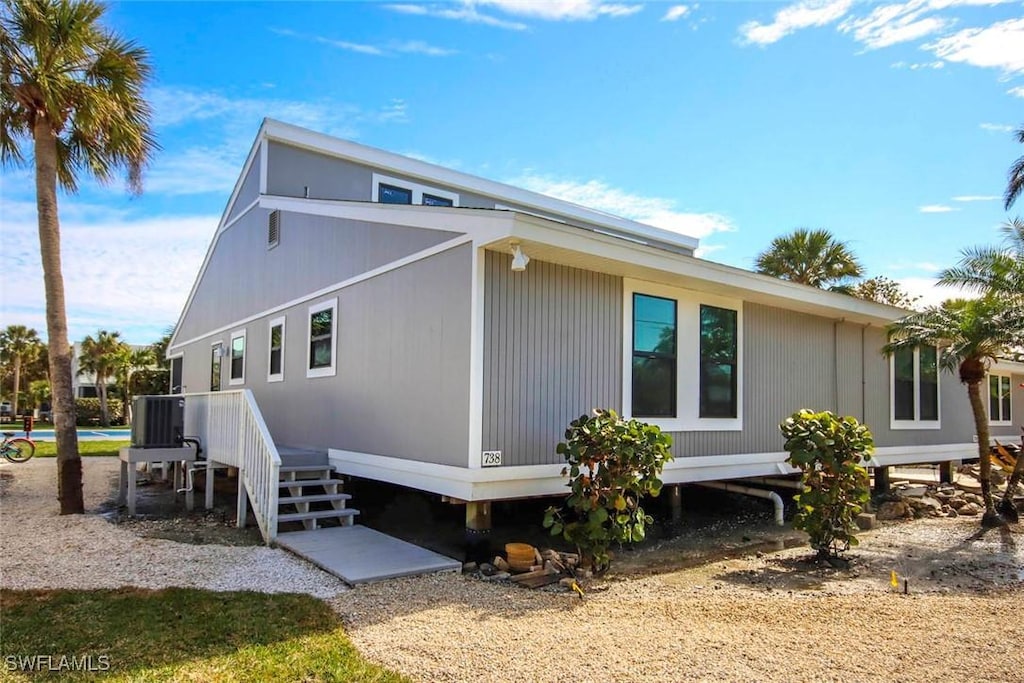 view of side of home featuring central AC