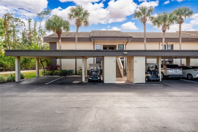 view of parking / parking lot with a carport