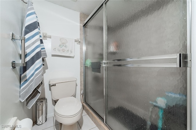 bathroom with walk in shower, tile patterned floors, and toilet