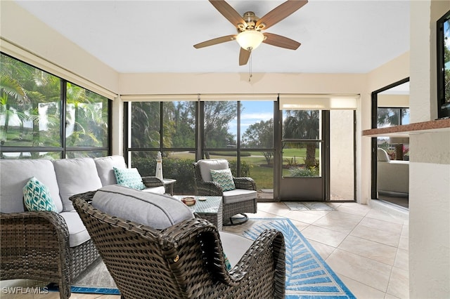 sunroom featuring ceiling fan