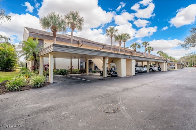 view of vehicle parking featuring a carport