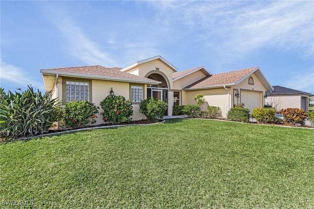 ranch-style house featuring a garage and a front yard