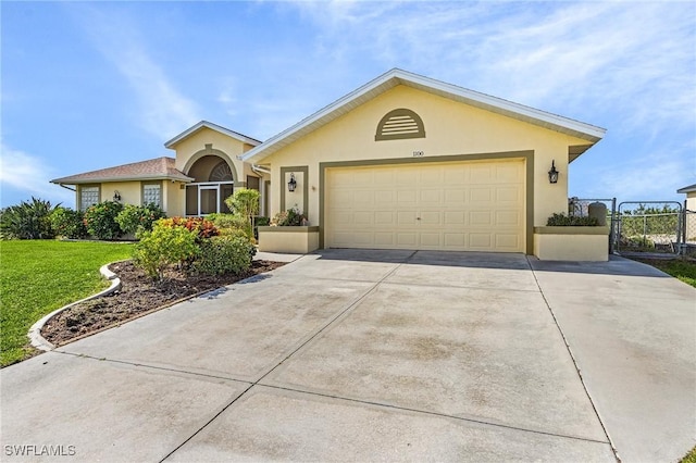 ranch-style house with a garage and a front yard