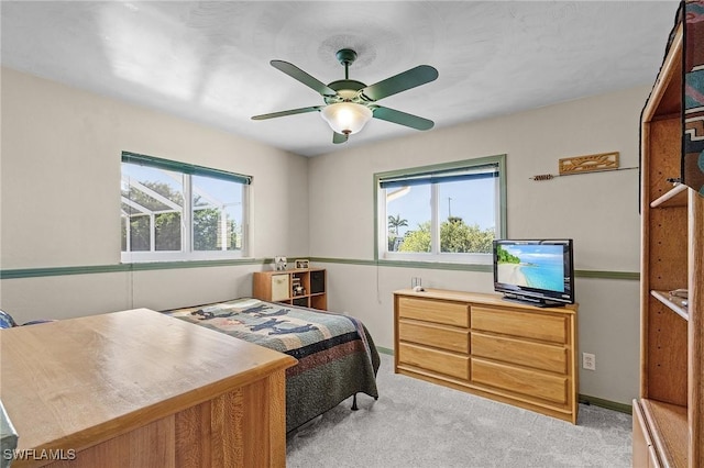 bedroom with light carpet and ceiling fan