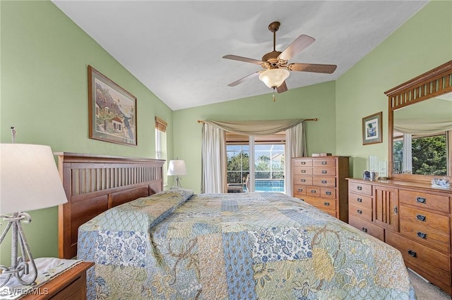 carpeted bedroom featuring ceiling fan, lofted ceiling, and access to exterior