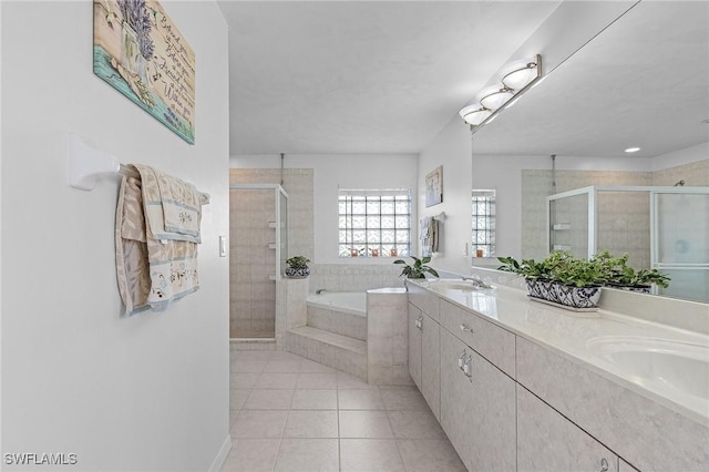 bathroom with tile patterned flooring, plus walk in shower, and vanity