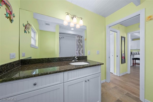 bathroom featuring vanity and walk in shower