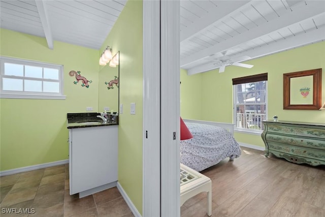 bedroom with hardwood / wood-style flooring, sink, vaulted ceiling with beams, and wooden ceiling