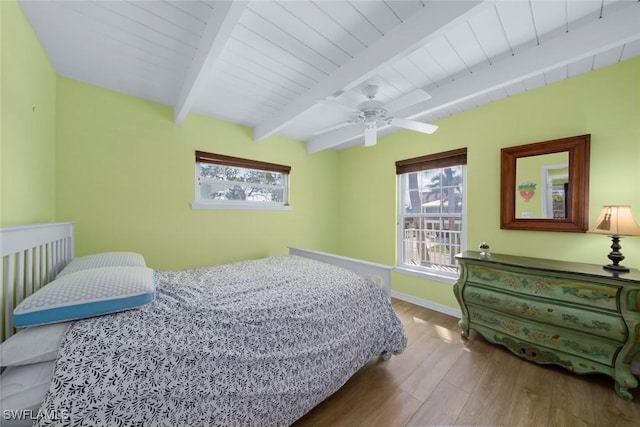 bedroom with hardwood / wood-style floors, wooden ceiling, and beam ceiling