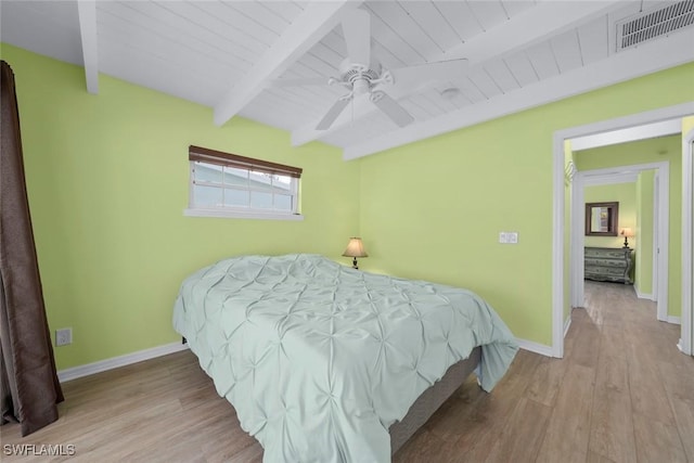 bedroom featuring ceiling fan, wood ceiling, beam ceiling, and light hardwood / wood-style flooring